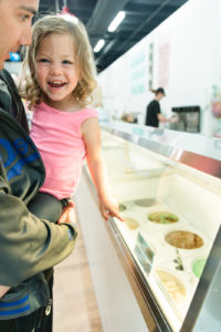 Small Child Pointing at Ice Cream